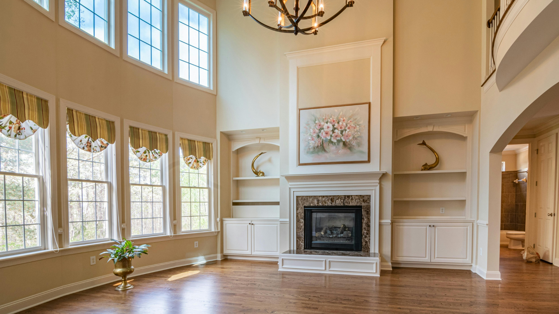 Grand OpenLiving Room with Fireplace View more by Curtis Adams from Pexels